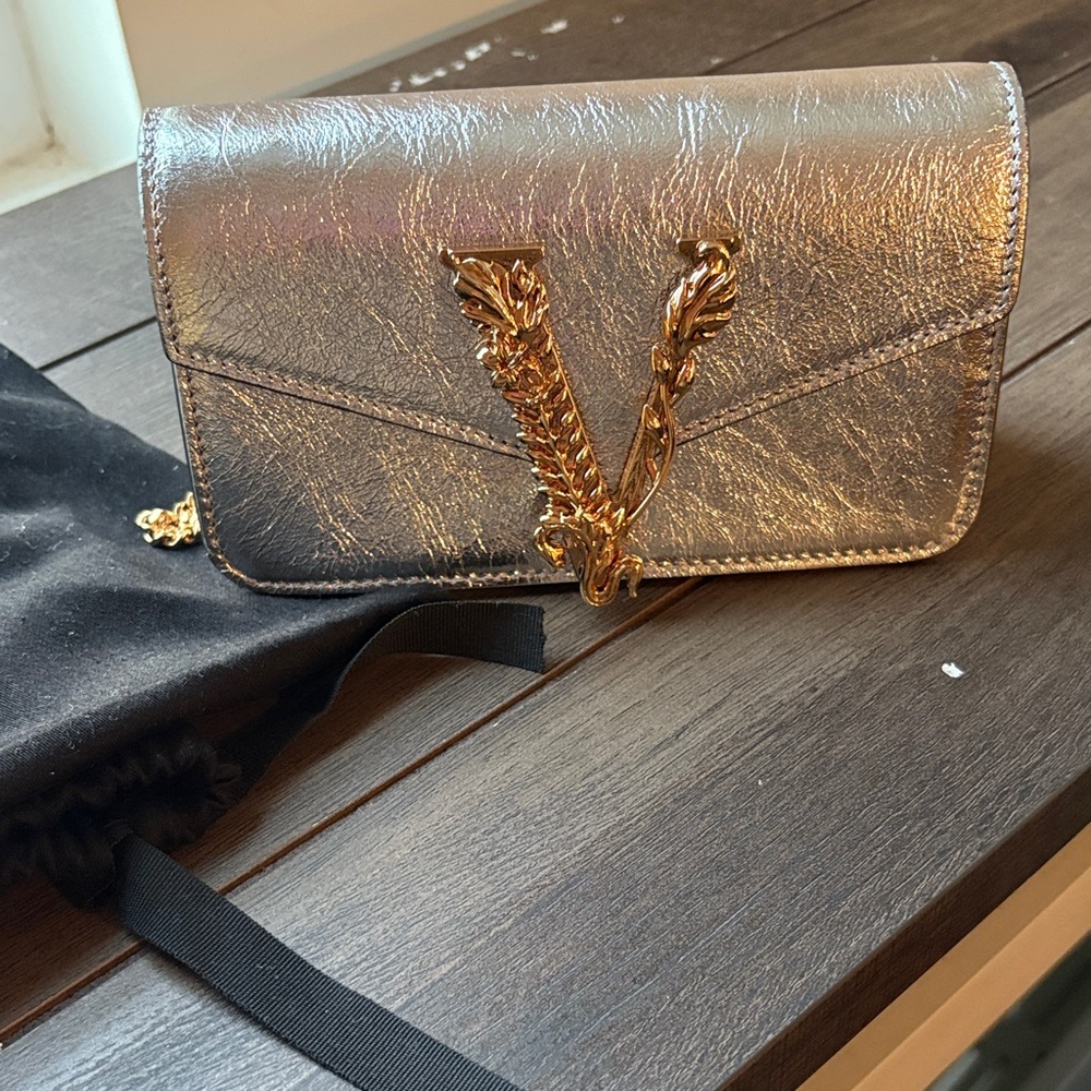Versace Metallic Silver Clutch with Gold V Accent